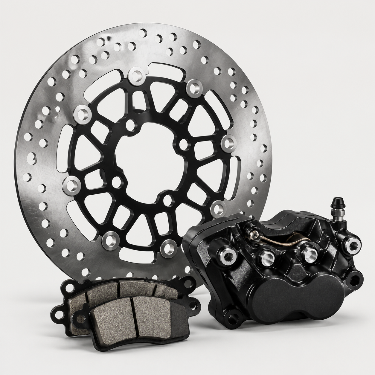 Powersports brake rotor, caliper, and brake pads