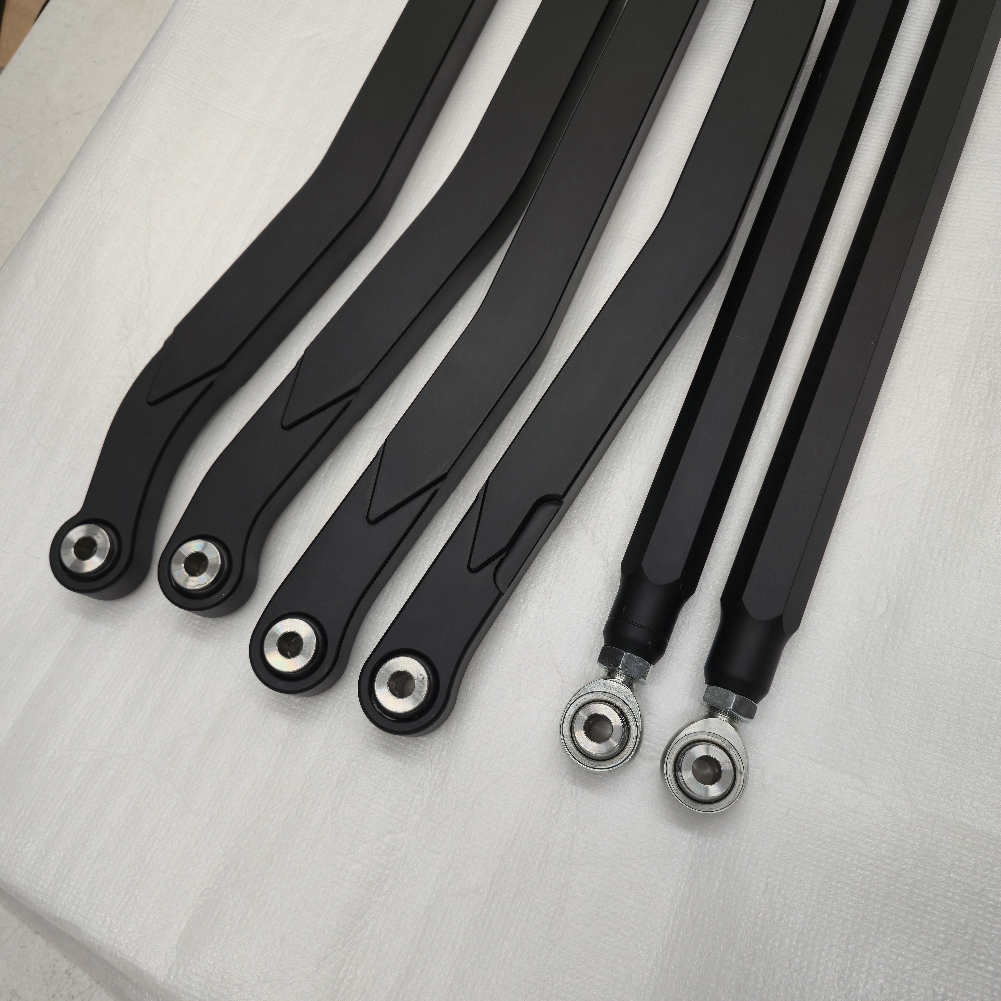 Angled view of CA Technologies high-clearance radius rods and installed bearings