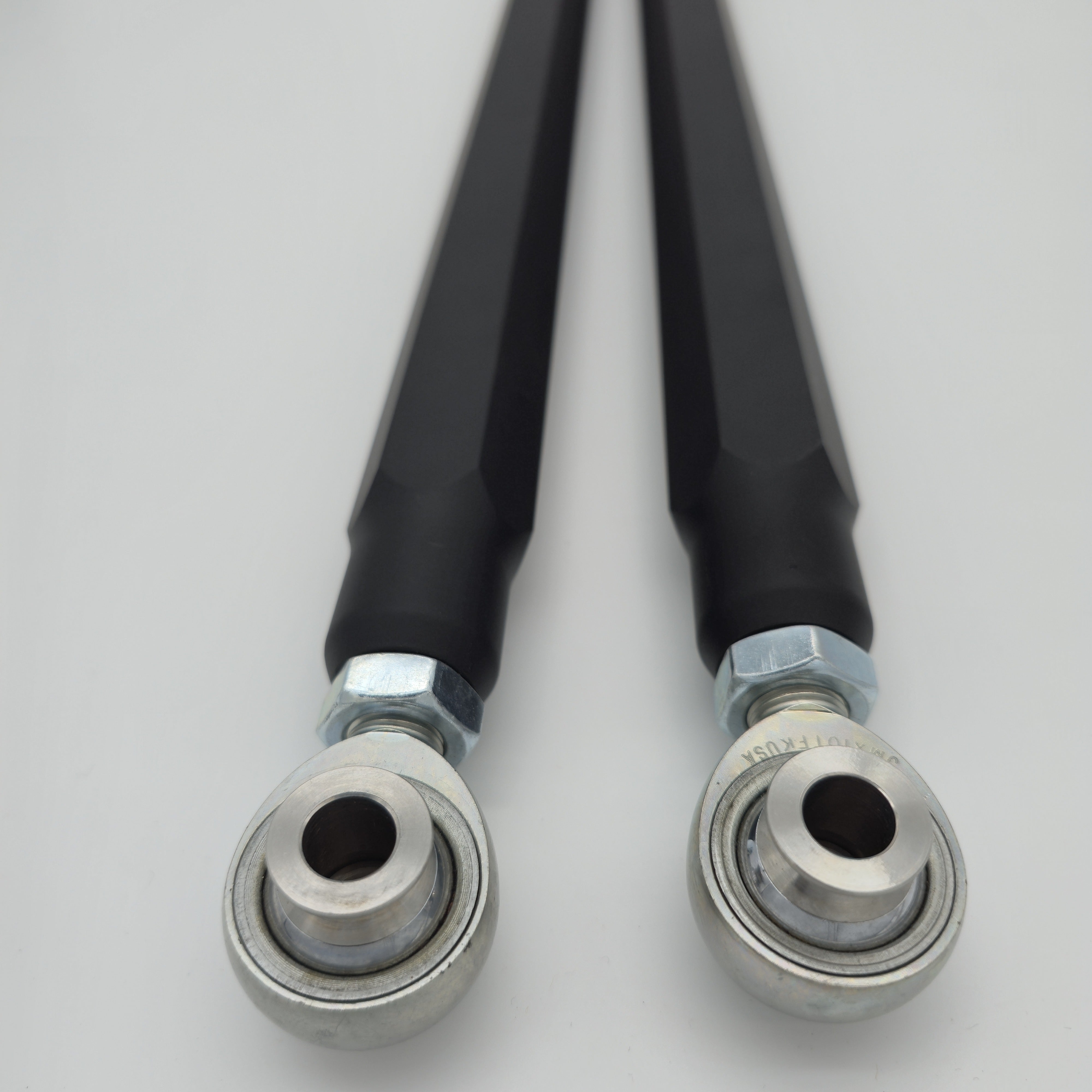 Close-up of FK rod ends and stainless-steel spacers on CA Technologies radius rods