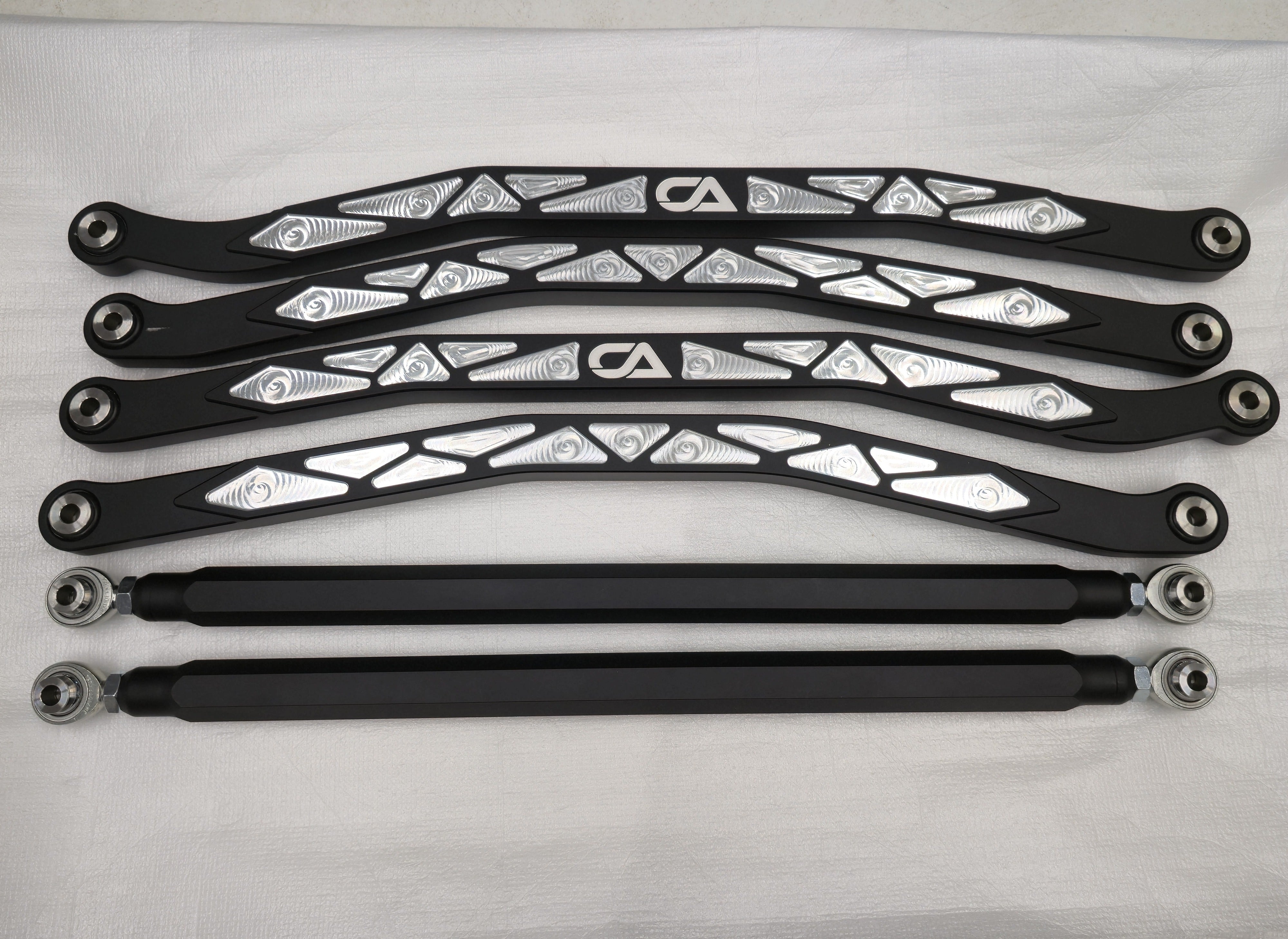 Complete six-piece CA Technologies radius rod kit showing black milled-pocket finish