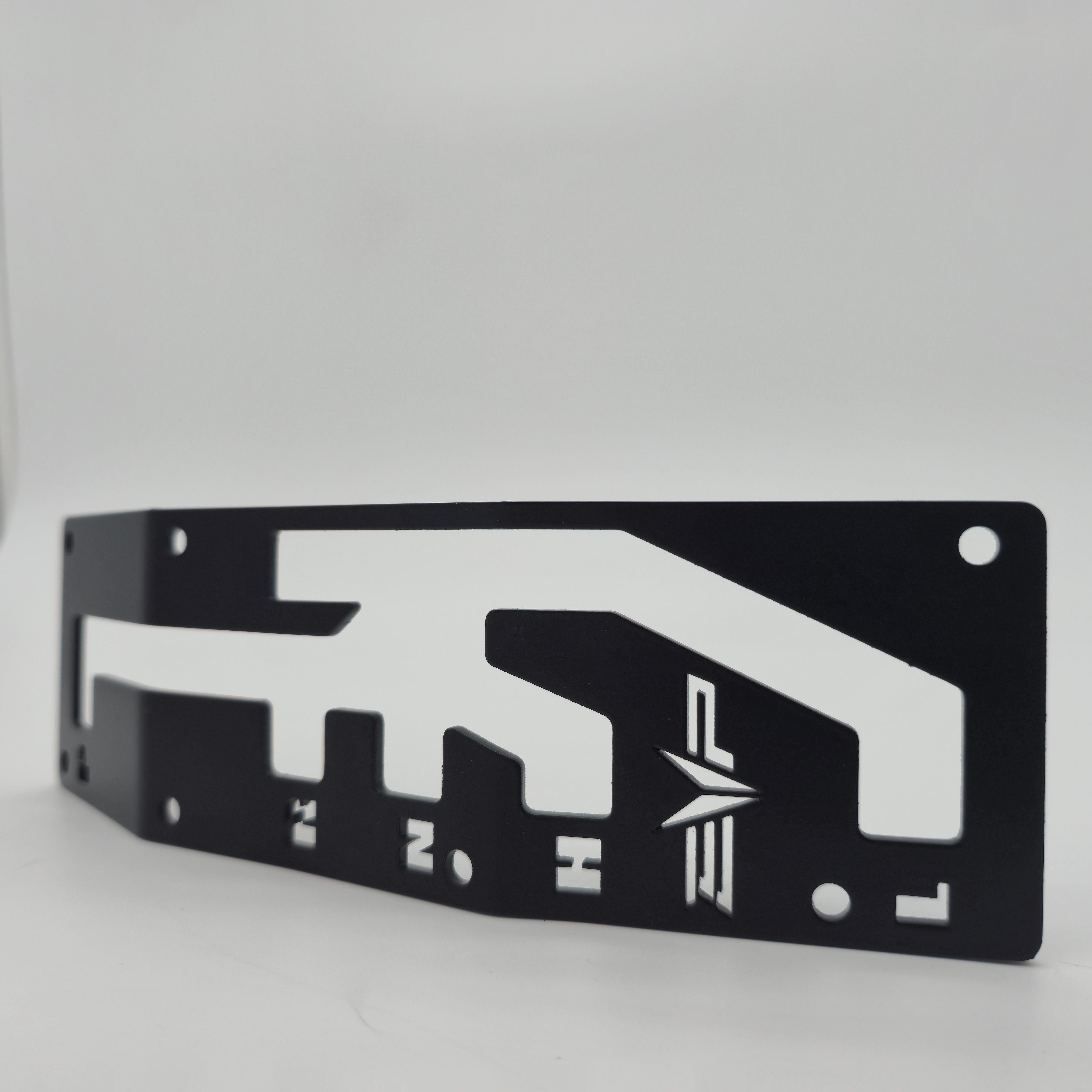 Can-Am Maverick X3 black shift gate plate — perspective view of mounting tabs and plate depth